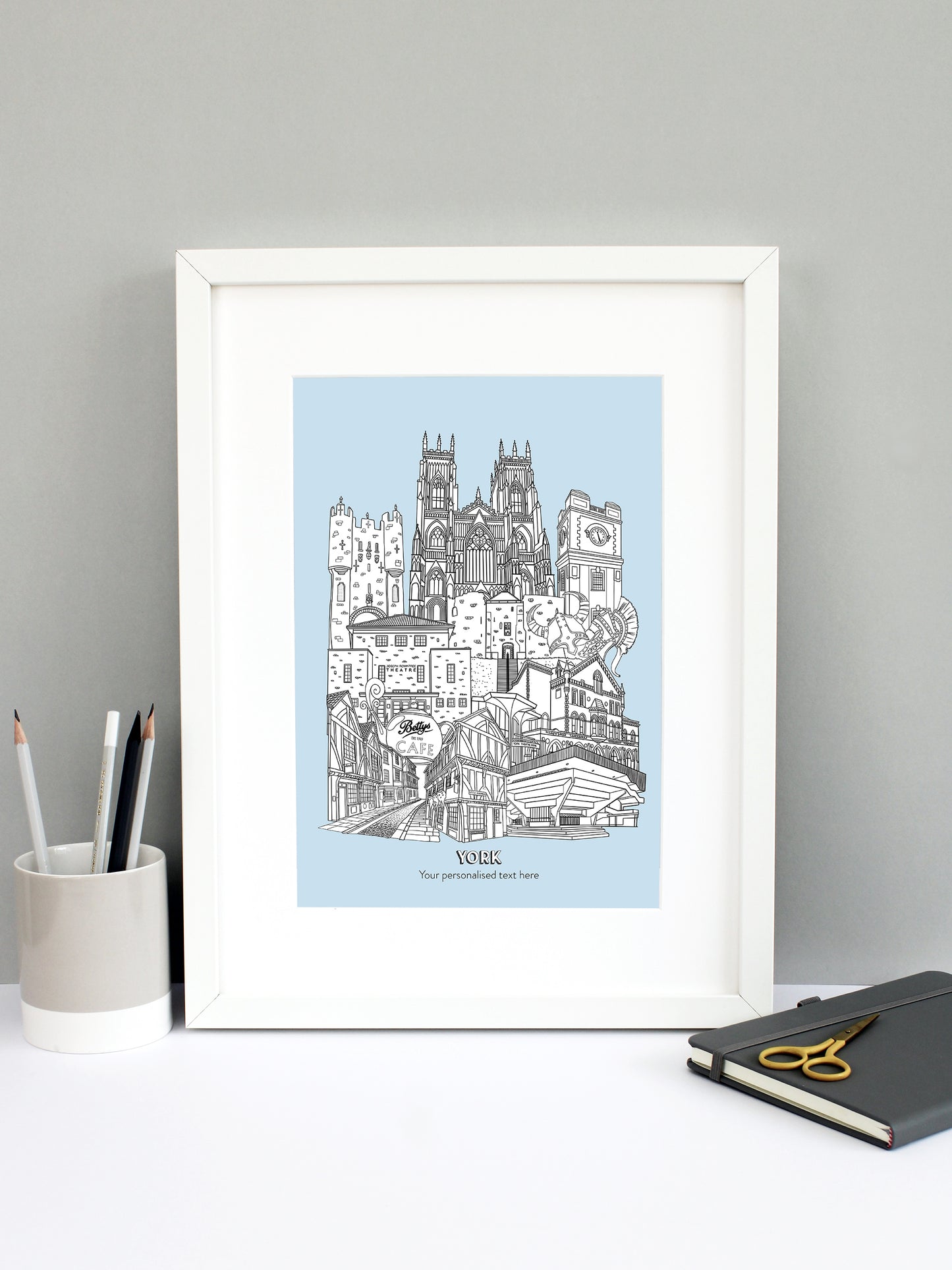 Beautifully detailed York Illustration print. The perfect gift for an engagement, wedding, birthday, anniversary and house warming. It features all the well known buildings and landmarks from the historical UK city. The buildings featured are: Bettys Tea Shop, Central Hall University, Joseph Rowntree Theatre, Micklegate Bar, Terrys Clock Tower, The Sambles, Clifford's Tower, York Theatre Royal and York Minster.