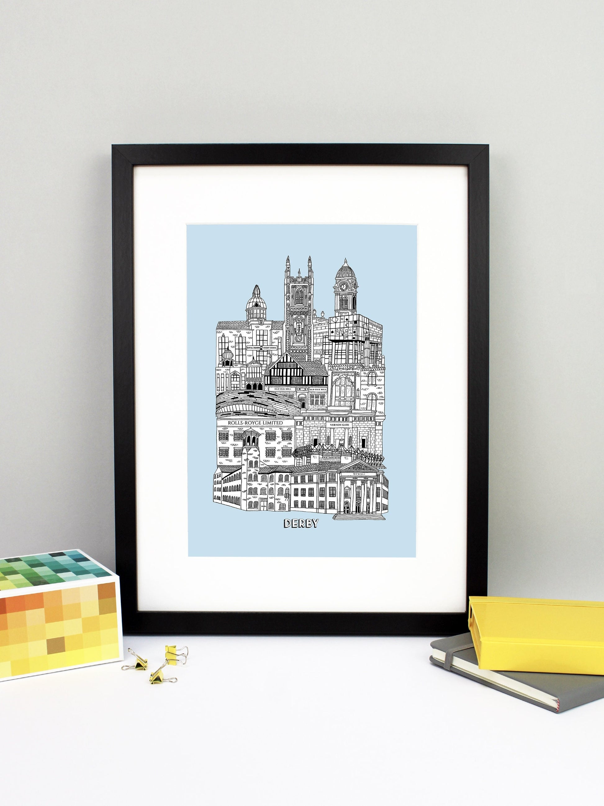 Beautifully detailed Derby illustration print. The perfect gift for an engagement, wedding, birthday, anniversary and house warming. It features all the well known buildings and landmarks from the vibrant UK city. The buildings and landmarks featured are: The Silk Mill, Derby Council House, Pride Park Stadium, Rolls Royce, Vernon Gate, Derby Velodrome, Guru Arjan Dev Gurdwara, The Old Silk Mill pub, Derby Jamia Mosque, The Quad, Royal Crown Derby, Derby Cathedral and the Guildhall.