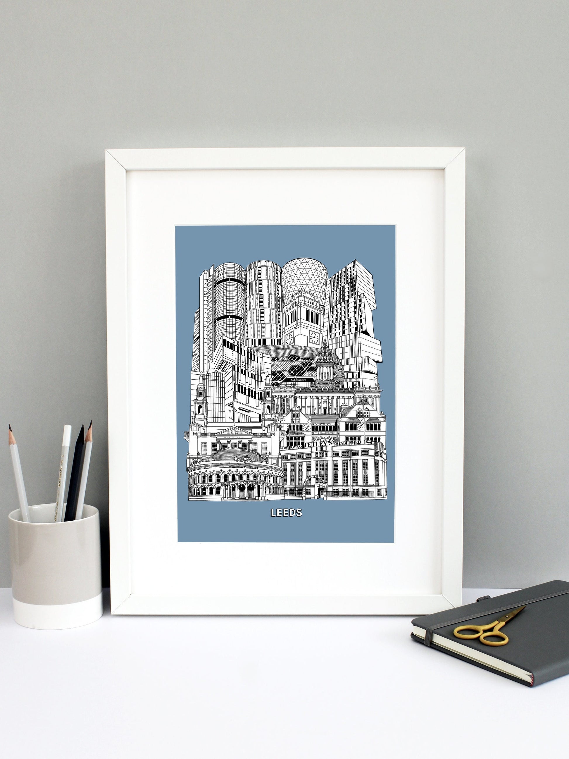Beautifully detailed Leeds Illustration print. The perfect gift for an engagement, wedding, birthday, anniversary and house warming. It features all the well known buildings and landmarks from the vibrant UK city. The buildings and landmarks featured are: The Corn Exchange, The Tetley, Grand Arcade, Civic Hall, Roger Stevens Building, Town Hall, First Direct Arena, Broadcasting Tower, Rose Bowl at Leeds Metropolitan University, Parkinson Building clock tower, Candle House and Bridgewater Place.