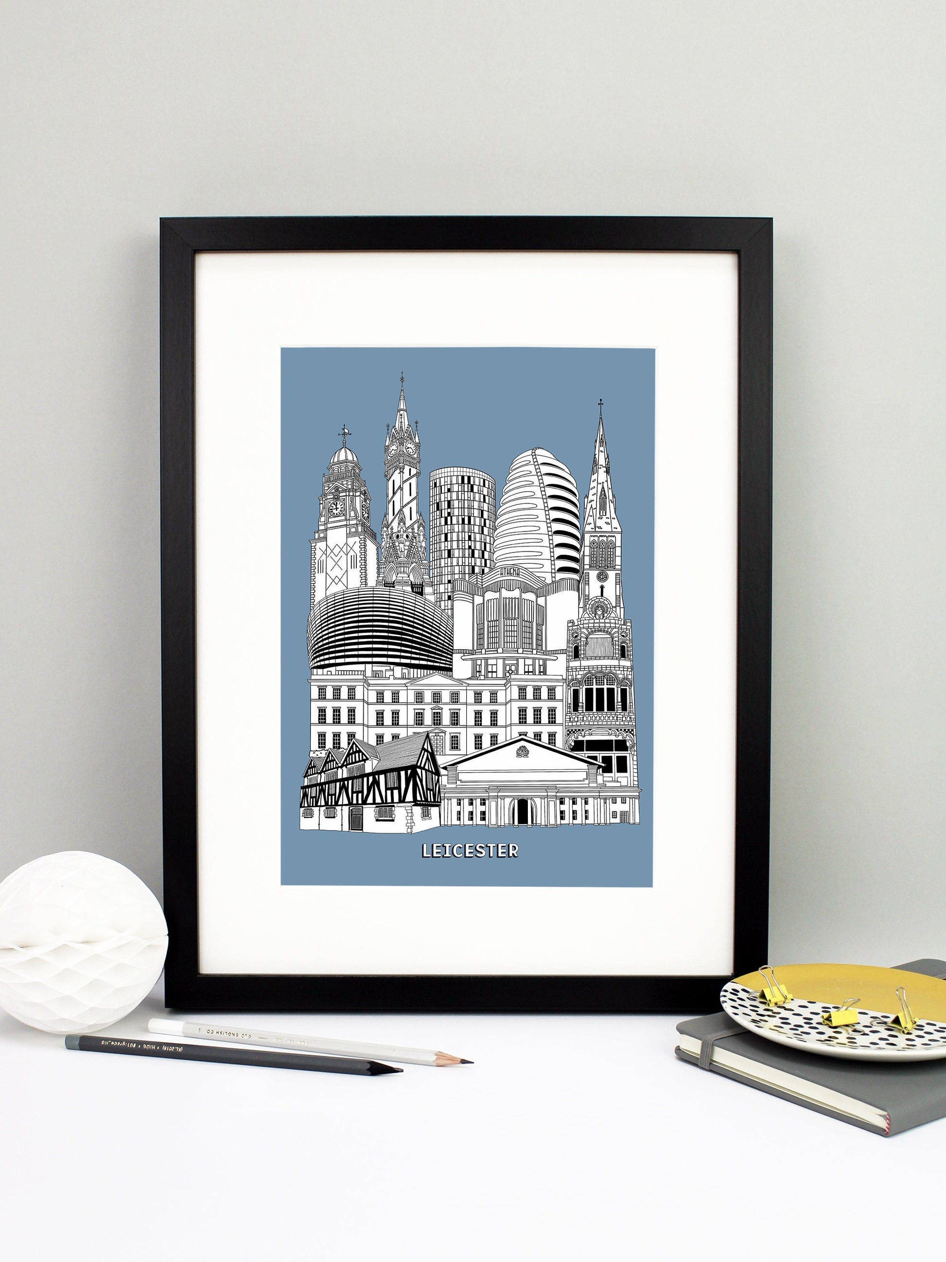Beautifully detailed Leicester Illustration print. The perfect gift for an engagement, wedding, birthday, anniversary and house warming. It features all the well known buildings and landmarks from the vibrant UK city. The buildings and landmarks featured are: The Guildhall Museum, De Montfort Hall, the Turkey Cafe, University of Leicester, the Curve Theatre, Athena (originally the Odeon), Leicester Cathedral, National Space Centre, the Summit (aka the loo roll!), Haymarket Memorial Clock Tower and the Town 