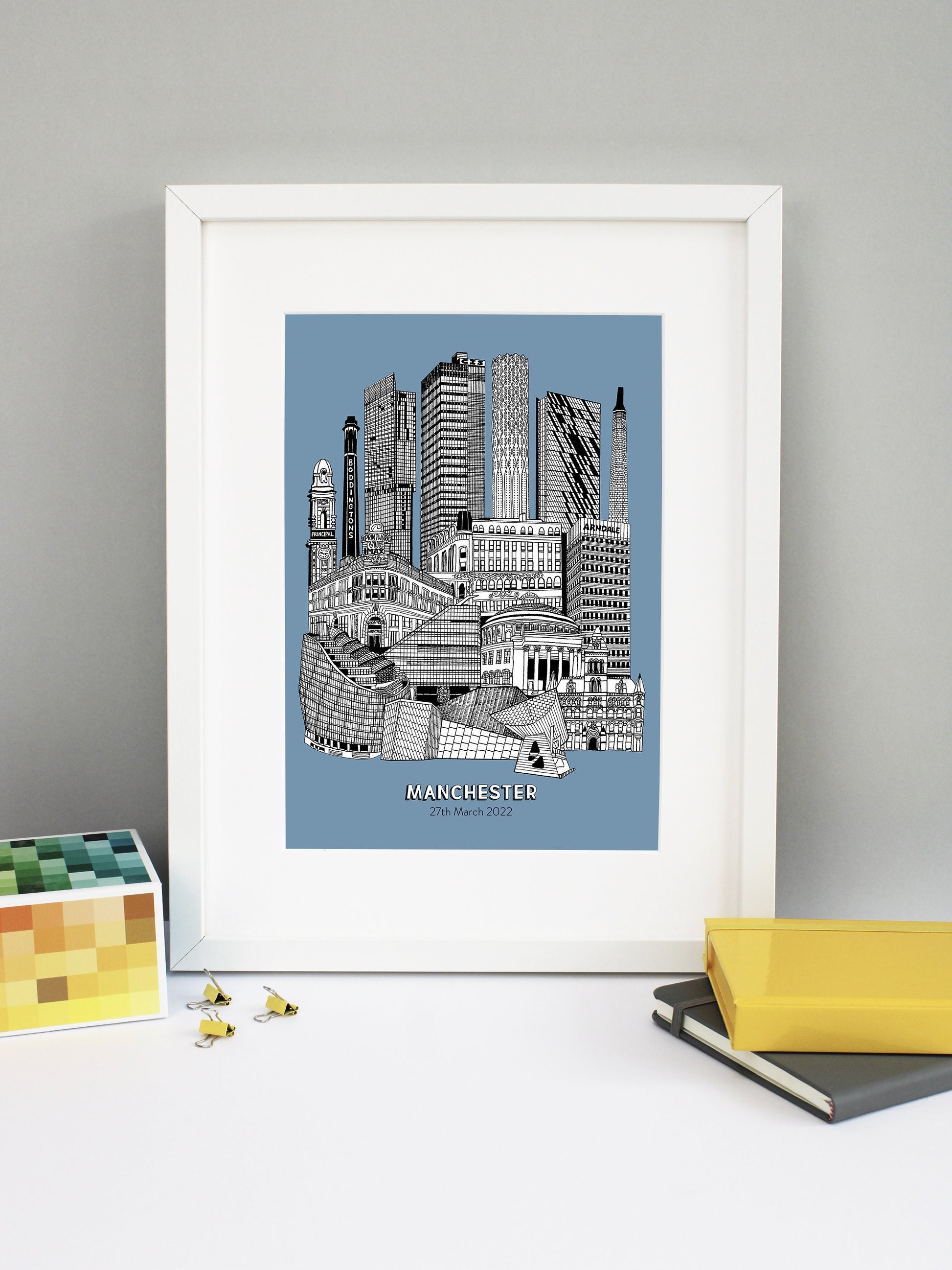 Beautifully detailed Manchester Illustration print. The perfect gift for an engagement, wedding, birthday, anniversary and house warming. It features all the well known buildings and landmarks from the vibrant UK city. The buildings and landmarks featured are: The Lowry, Angel Row, The Printworks, The Principal Hotel, Boddingtons Chimney, Beetham Tower, CIS Tower, Tower of Light, Axis Tower, Macintosh Factory Chimney, Afflecks Palace, Arndale Centre, The Urbis, Manchester Central Library and Manchester Town