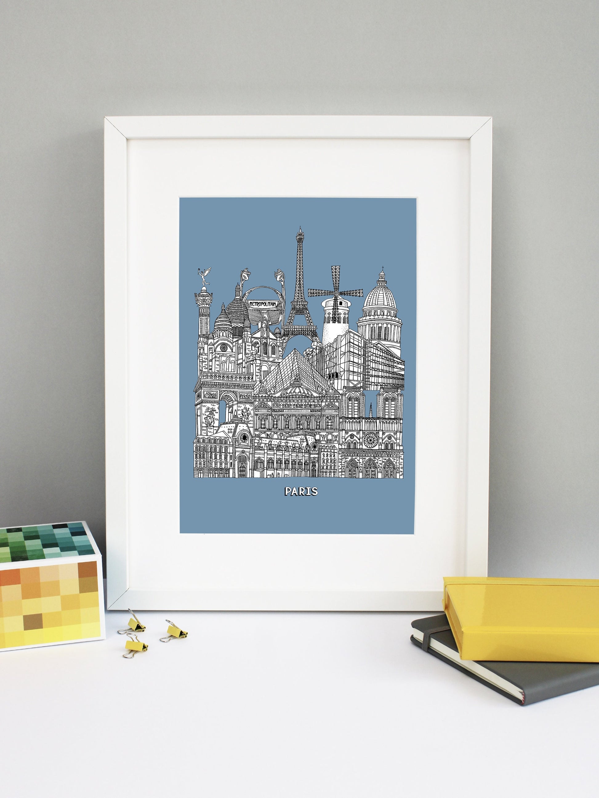 Beautifully detailed Paris Illustration print. The perfect gift for an engagement, wedding, birthday, anniversary and house warming. It features all the well known buildings and landmarks from the vibrant city. The buildings and landmarks featured are: Musée d'Orsay, Notre-Dame, The Palais Garnier, Arc de Triomphe, Louvre Museum, The Centre Pompidou, Sacré-Cœur, The Paris Métro, The July Column, The Eiffel Tower, Moulin Rouge windmill and the Panthéon.